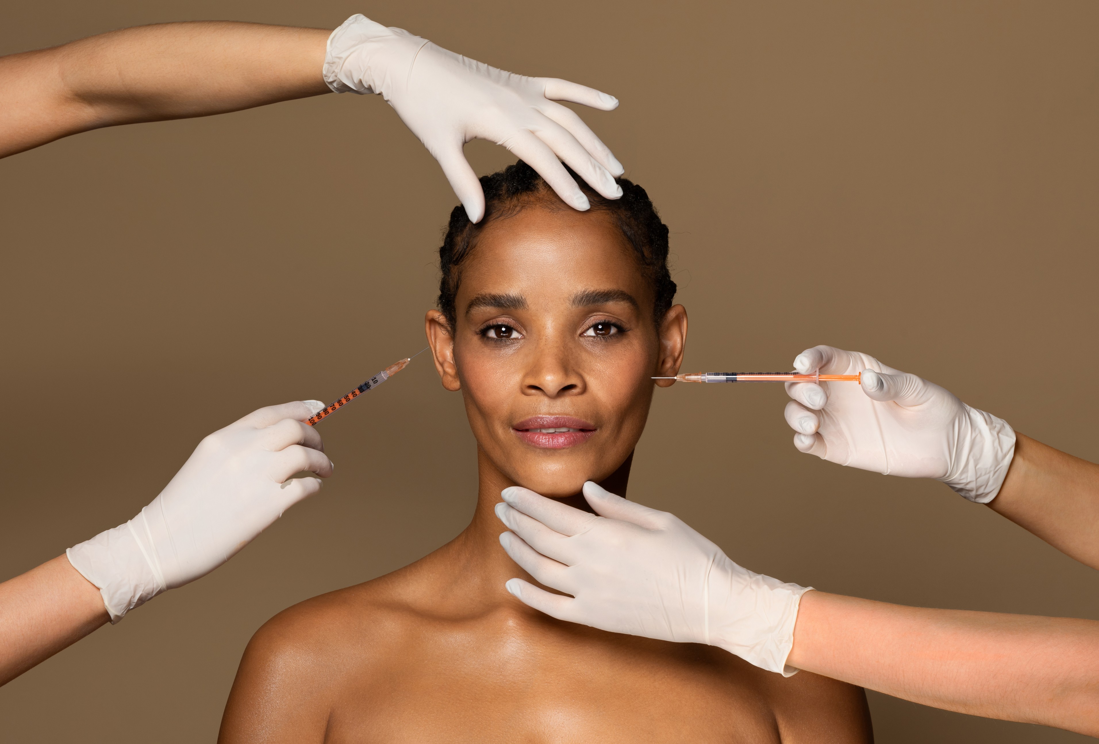 Woman receiving cosmetic facial injections treatment