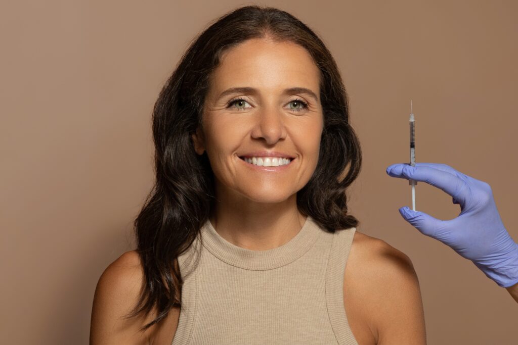 Woman smiling receiving vaccine injection